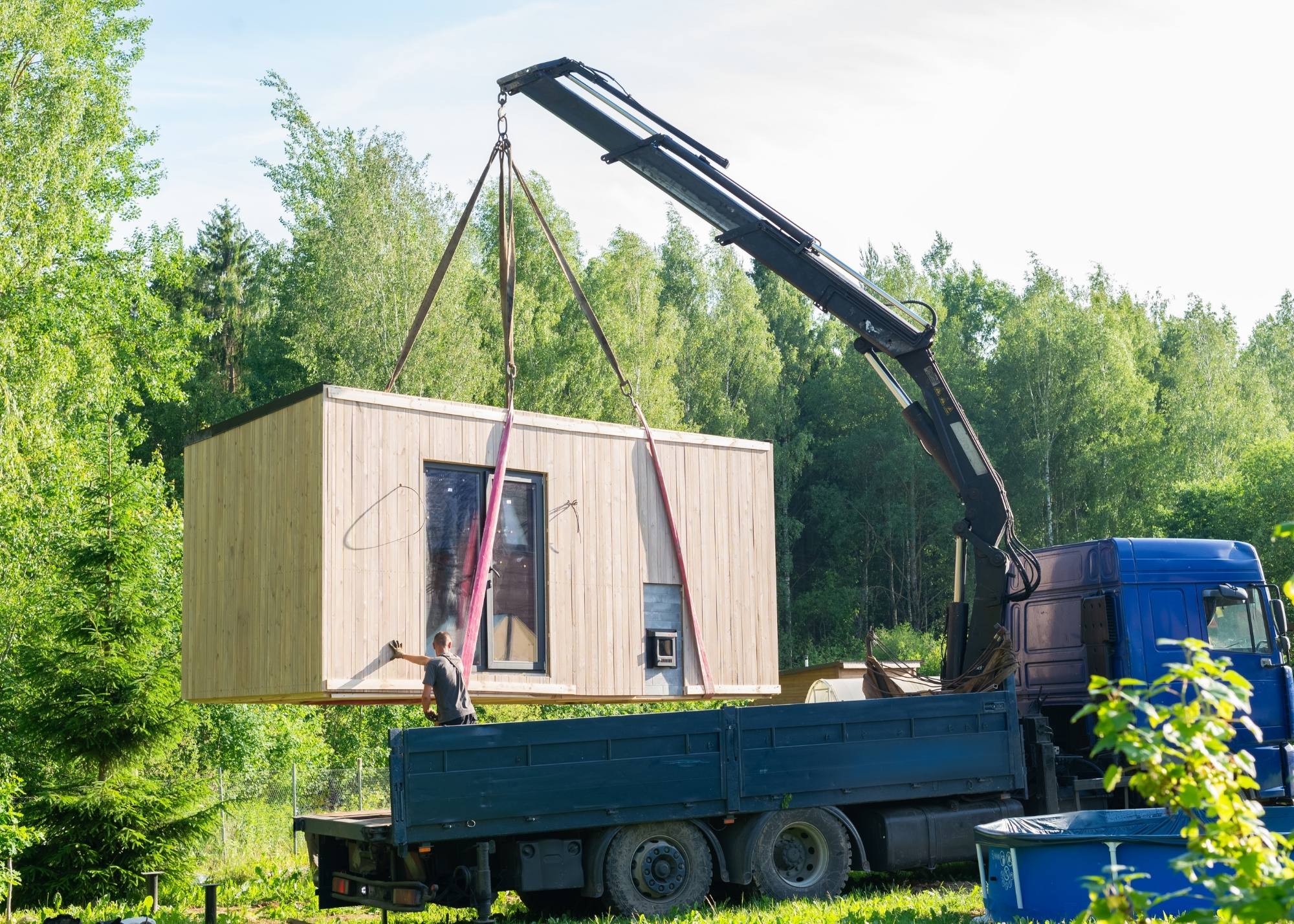 Crane delivering a modular home